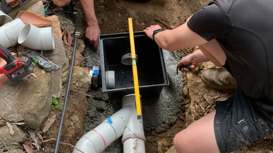 SXP Plumbing professional clearing drain in Northern Beaches property